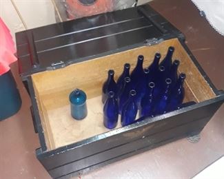 Blue bottles in a nice condition wooden crate with lid