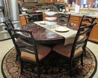 Round dining table w/ 6 chairs.  Glass top table cover not included.  