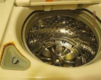 LG Washing machine.  Very clean except for discoloration around Bleach/Softener dispenser