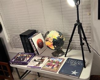 Globe lights up, super neat. Cool movie stage staple tripod light, some great books. TCU , Cowboys, NBA, Texas A&M