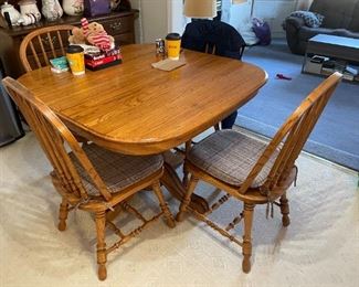 . . . beautiful Amish-style oak kitchen table and chairs