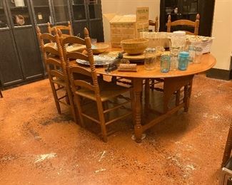 Large table with removable leaves. Has six chairs