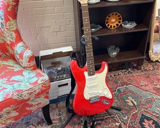 Guitar with stand, case, and amplifier. Looks brand new!