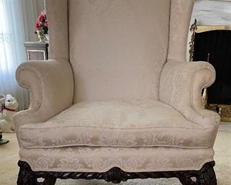 Antique Wing Back Chair with Claw Feet Upholstered in Neutral Damask Upholstery. Measures 33" W x 32" D x 42" H. Photo 1 of 4.