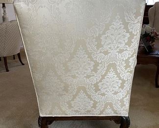 Antique Wing Back Chair with Claw Feet Upholstered in Neutral Damask Upholstery. Measures 33" W x 32" D x 42" H. Photo 3 of 4.