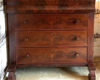 Antique Empire Flame Mahogany Three-Drawer Chest of Drawers. Measures 43" W x 22" D X 44.5" H. 