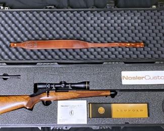 ***FIREARM ONLY ONSITE DURING SALE HOURS *** "Nosler Custom NCR09-224 338 Win Mag
NCR - NOSLER CUSTOM RIFLE (CUSTOM LIMITED EDITION SERIES)
.338 Win. Mag. (Series 3) cal., NoslerCustom barreled action, 24 in. match grade stainless steel barrel,
one-piece steel hinged floorplate, no sights, fancy checkered American black walnut stock with forend
and pistol grip caps, Pachmayr Decelerator recoil pad, subtle palm swell and shadow line cheekpiece, 3-
position Rocker safety, integral Leupold QD scope mounts, shipped in Pelican hard case with leather
sling, Cerakote and Micro Slick finishes, 9 lbs. Only 500 of each series mfg. (ser. no. range 001-500).
Limited mfg. 2005-2016.
The Series 3 rifle comes with Leupold VXIII 2.5-8x36mm, VXIII 3.5-10x40, or VXIII 4.5-14x40 scope,
calibrated for the Nosler ammunition sold with the rifle." Description prepared by Gerard Kardonsky, Attorney, FFL, Owner Black-Tie Guns