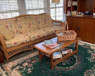 Wicker sofa, rug, & coffee table 