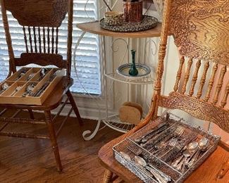 Corner baker's rack, pressed back oak chairs, stainless flatware