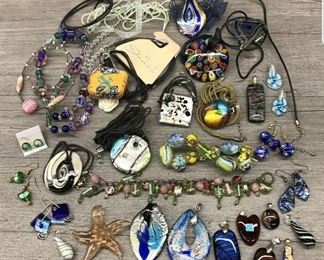 Costume jewelry lot with assortments of colorful glass necklaces bracelets earrings and pendants $75 for all or $15 each piece 