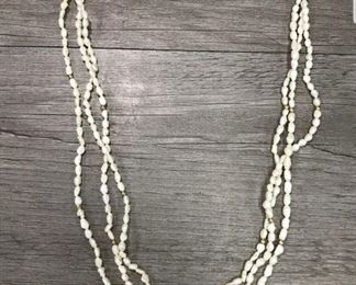 Triple strand pearl necklace  $150