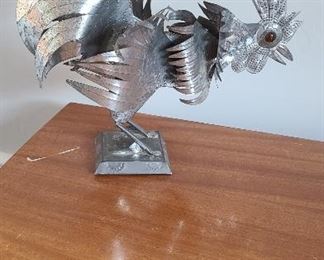 Stamped steel sculpture with glass eyes