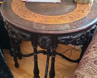 Antique side table with carved skirt