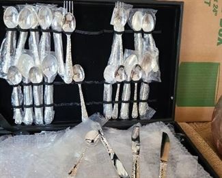 New, never used Oneida flatware set