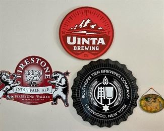 Assorted Wood and Tin Beer Signs - Uinta Wooden Sign $35, Firestone Union Jack India Pale Ale $35 and Southern Brewing Company Bottlecap $75.