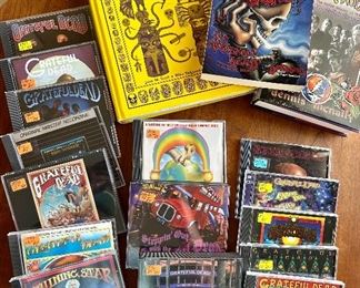 Assorted Vintage Grateful Dead CDs and Books