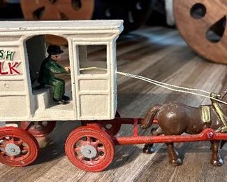 Cast Iron Fresh Milk Wagon w/Man being Pulled by a cast iron Horse