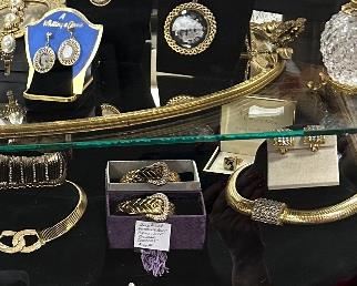 our jewelry is displayed in our antique oak cabinets