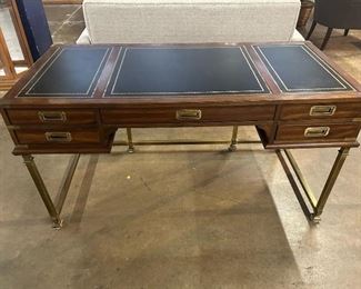 Campaign Desk with solid brass frame and hardware, black leather top with gold embossed trim.