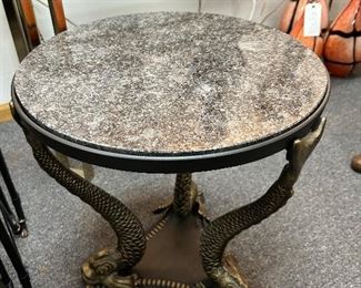 Granite top , brass dolphin table