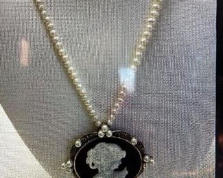 Sterling Long necklace cameo set, on black onyx with mother of pearl cameo, with pearls . Long pearl necklace.