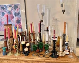 Large assortment of candles and candleholders 