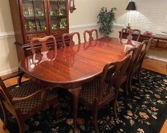$350. Queen Anne style Table with 2 leaves, table protector pads, 8 chairs. Overall very good condition. Measures 66" long + 2 - 15" leaves. 44" wide. 1 captains chair 7 regular chairs. 