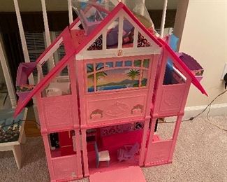 $60. Barbie Dream House with some accessories. 