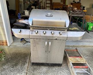 $100 - Char Broil Gas Grill with propane tank.