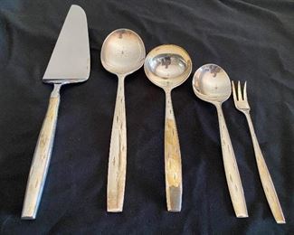 $1800. Service for 8 + serving pieces. Wallace Sterling "Discovery" pattern. 