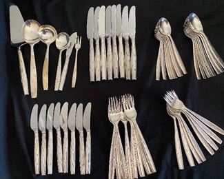 $1800. Service for 8 + serving pieces. Wallace Sterling "Discovery" pattern. 