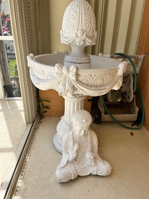 Cement fountain and buddha