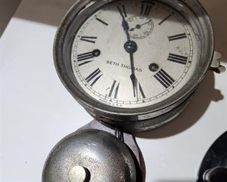 19th Century Ship's Clock - Strikes and Bells. Has key.  Paper on back  is an advertisement from a seller of this clock. 