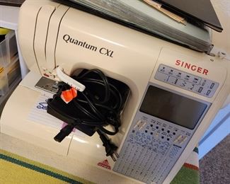 Portable Singer Sewing Machine w/Case. All kinds of sewing notions too!