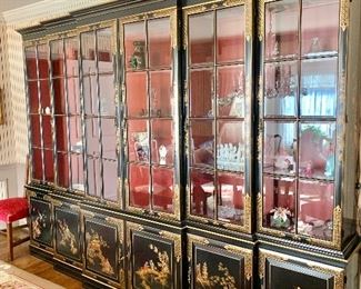 Vintage chinoiserie black lacquered breakfront with internal lighting