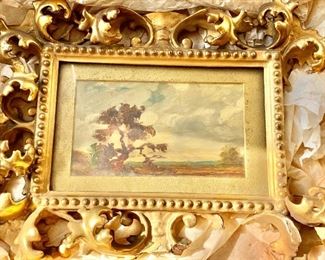 Oil painting of a tree with elaborate as is gilt frame 