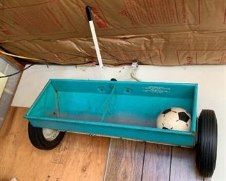 #128	Blue Metal Pull-Behind Seed Spreader 	 $30.00 
