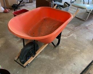 #134	Orange Plastic Wheelbarrow (has a flat tire)	 $30.00 
