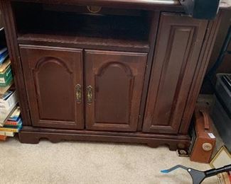 #245	tv stand with open shelf and 3 doors 32x18x27	 $30.00 
