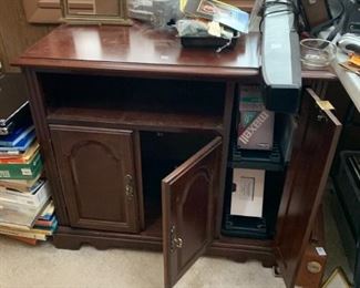 #245	tv stand with open shelf and 3 doors 32x18x27	 $30.00 
