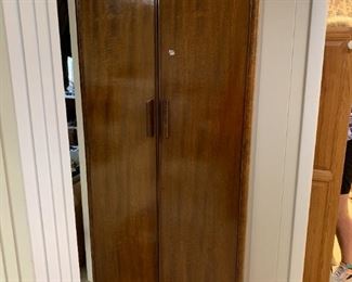 #247	Wood cabinet with 2 doors and inserted laminate shelves inside with the original wood shelves inside 39x13x72	 $100.00 
