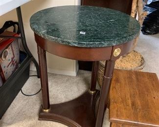 #248	green marble top round table with 3 pillar legs 18x25	 $35.00 
