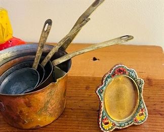  stack of small copper pots
