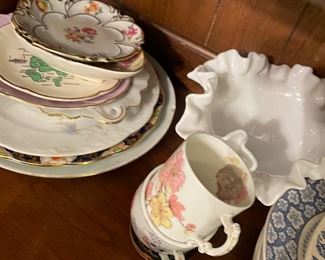 Antique teacups and decorative plates 