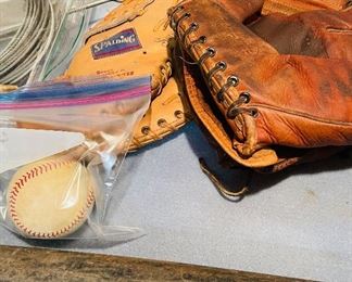vintage baseball gloves, wooden bat, balls 