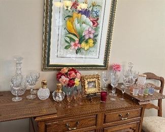 Watercolor painting and crystal on a pine buffet server