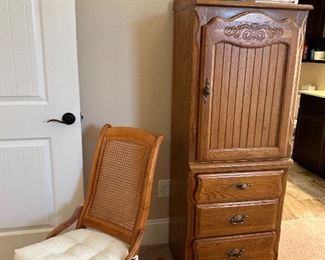 Cane back rocking chair and oak dresser by Stanley