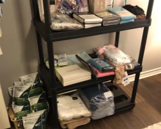 New in package curtains, household and clothing items. 