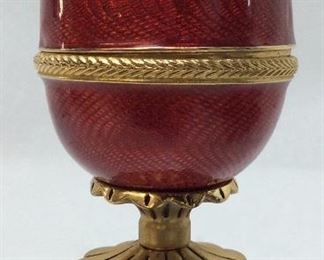 FINE FABREGE’ EGG RUBY RED ENAMEL WITH STAND,
