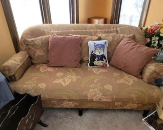 Yellow/red sofa with some sassy cat claw damage